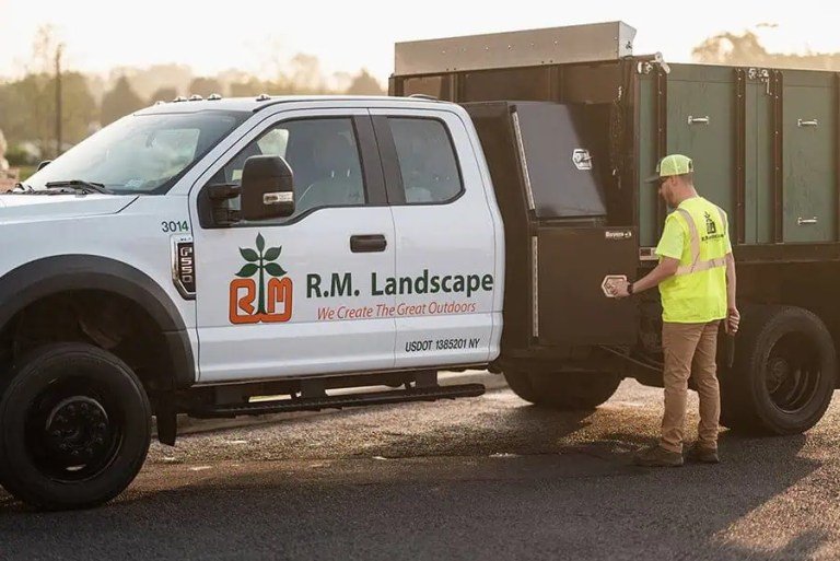 R.M. Landscape service truck at a commercial property